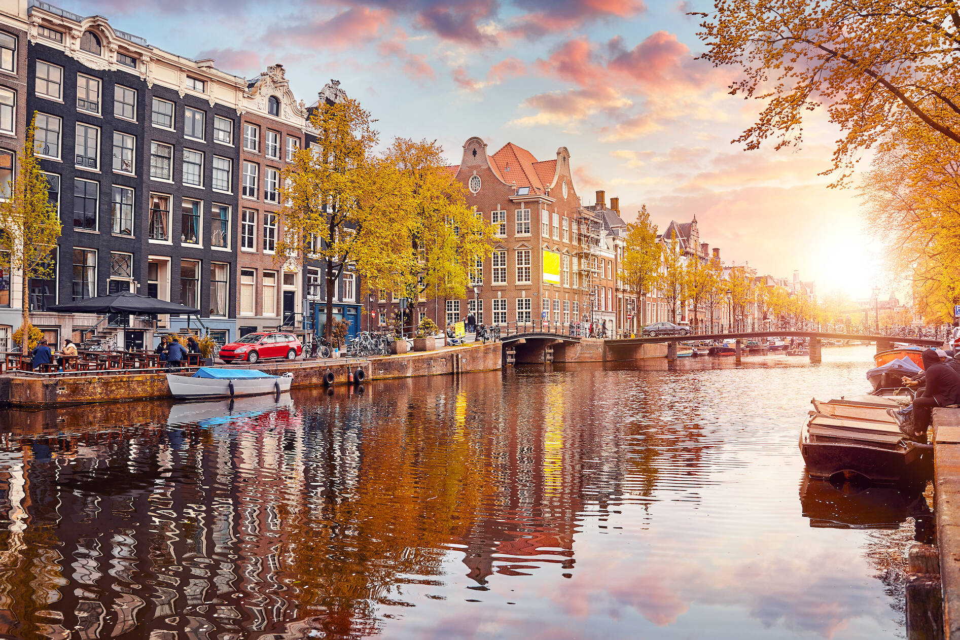 Channel in Amsterdam Netherlands houses river Amstel landmark old european city spring landscape.