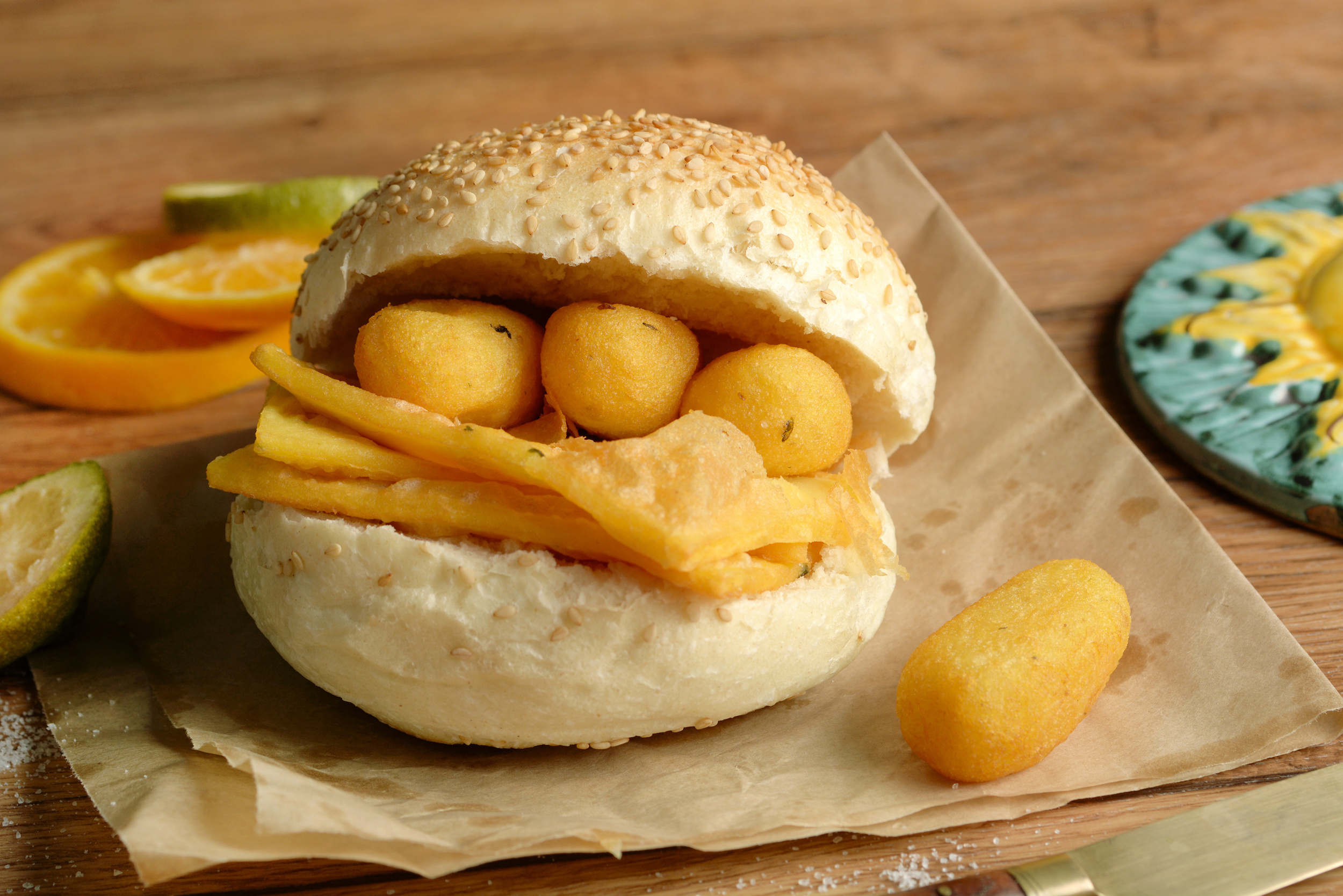 sandwich with panelle - traditional street food of Sicily - made with chickpea flour - closeup